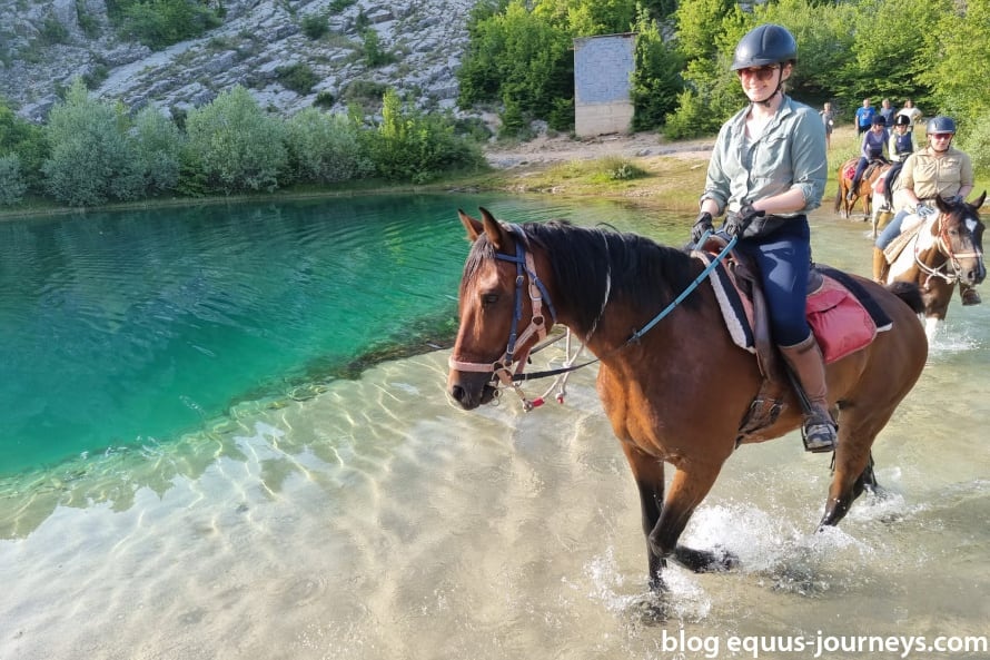 Iris and Oscar riding in the source of the Cetina river