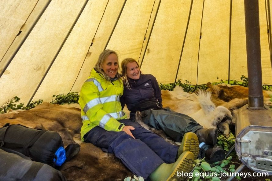 Two travellers in a Sami tent