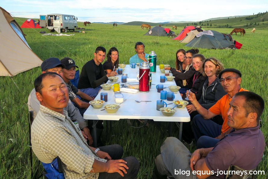 Locals and travellers enjoying a meal together