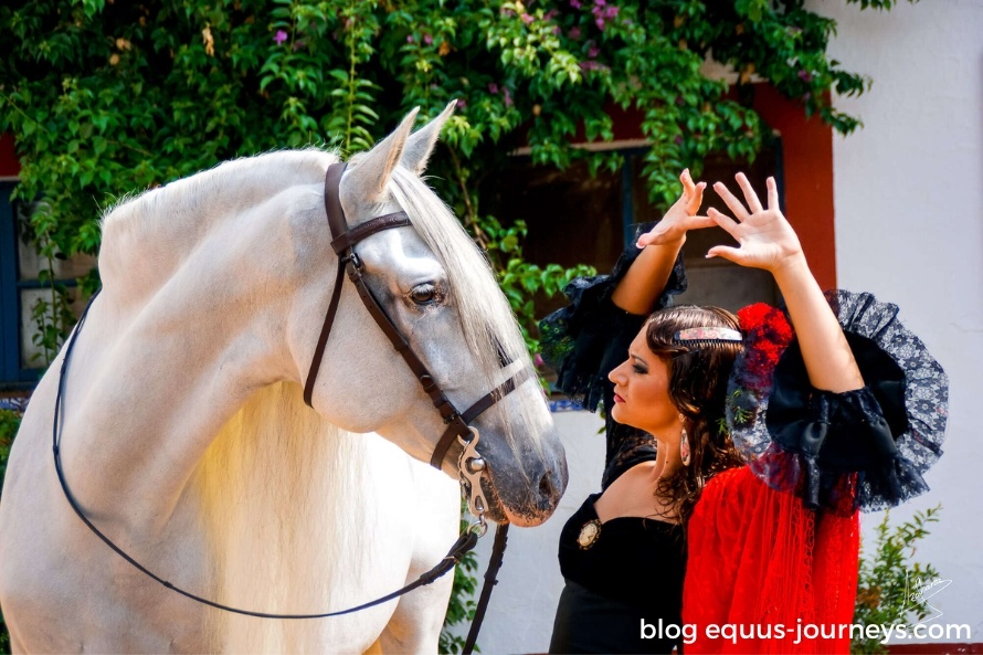 Woman dressed traditionally besides a horse