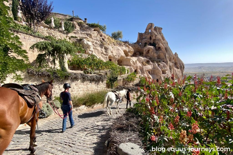 Riders entering a small village in Cappadocia