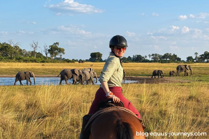 Iris riding with elephant