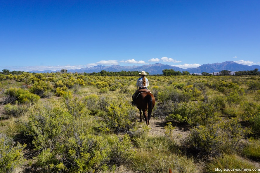 Riding at Zapata - Raphaelle's wrangler and the Sangre de Cristo mountains